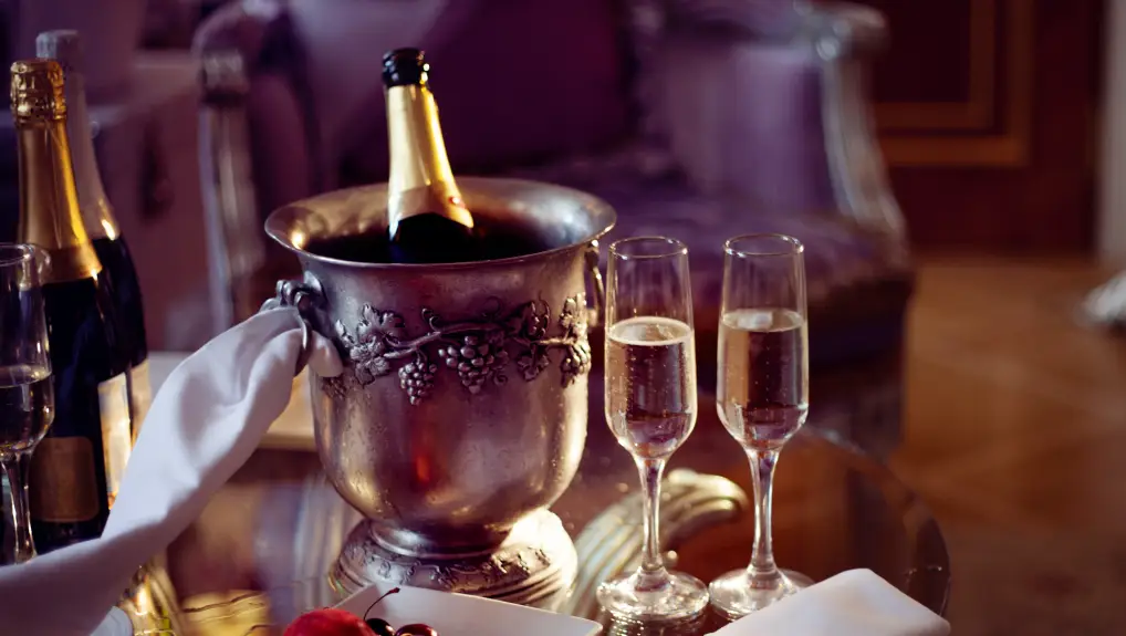 image of two glasses and champagne in the ice bucket