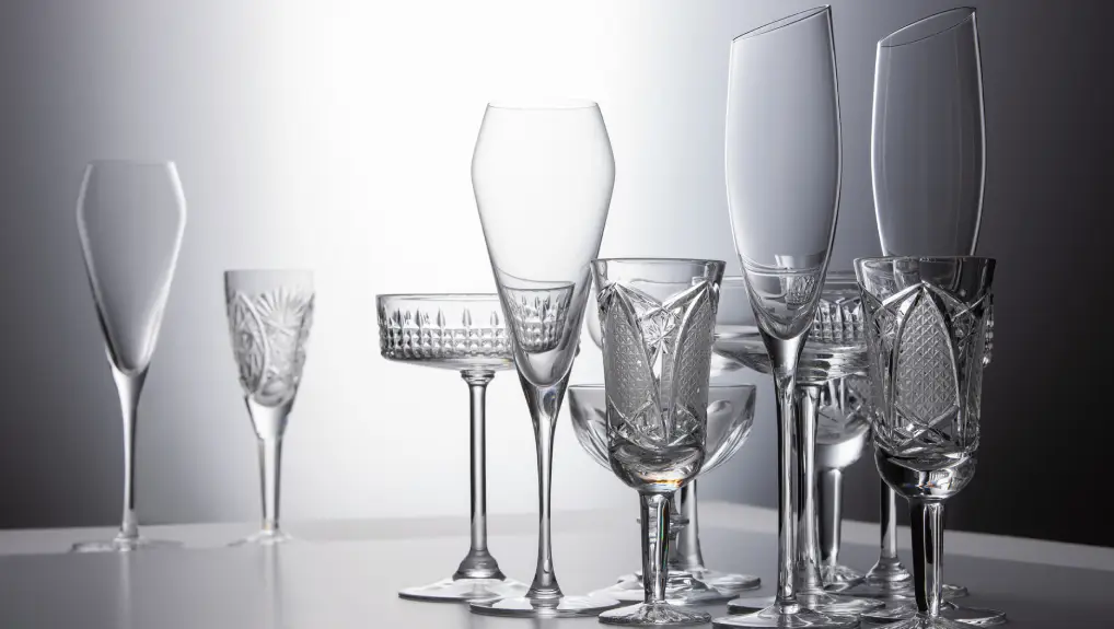 image of crystal champagne glasses of different shapes