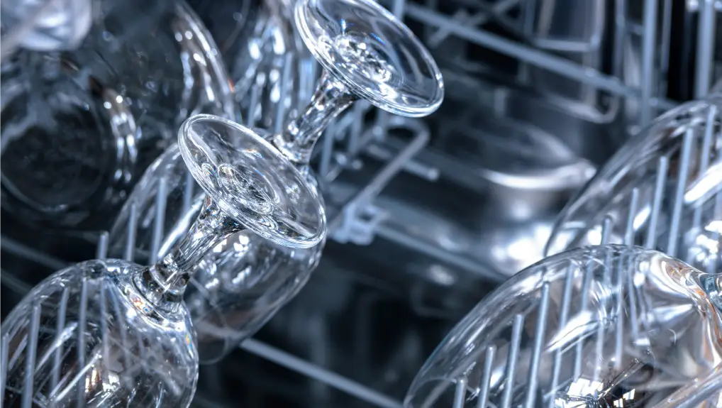 Shining glasses and dishes washed in the dishwasher