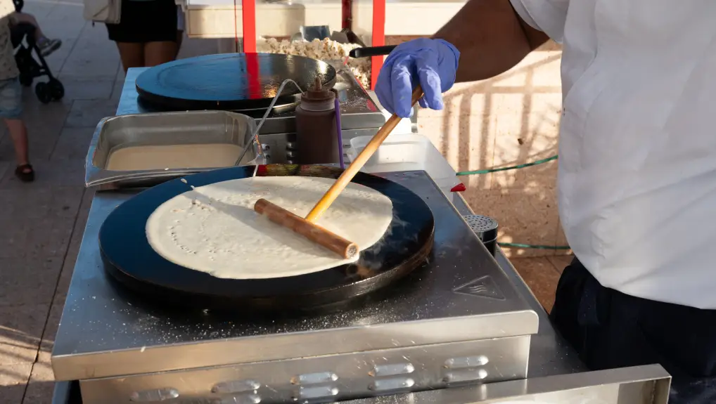 image of crepe machine being used by chef