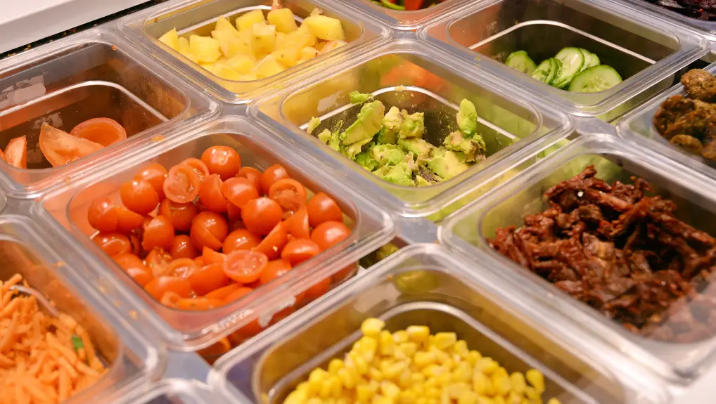 Image of Close up salad bar with various fresh vegetables in Gastronorm containers