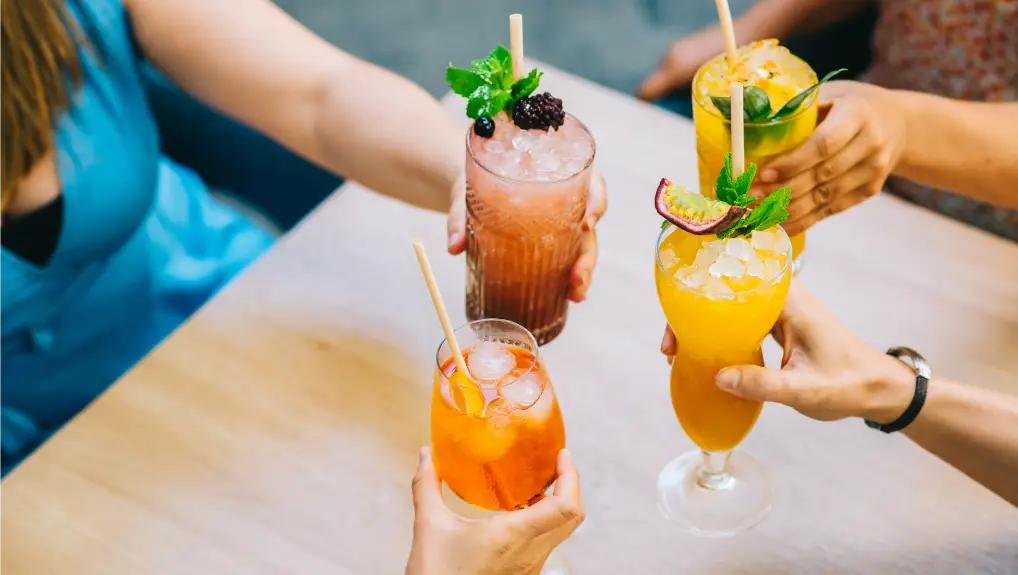 Image of friends clinking glasses with glasses celebrating in the afternoon on the terrace