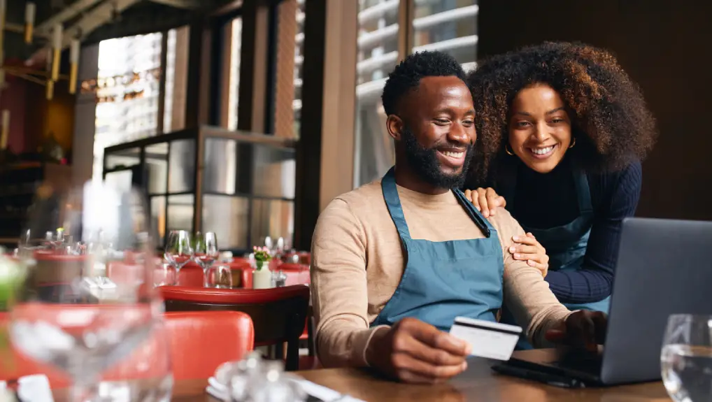 Image of a male and female couple buyings commercial bar equipment online.