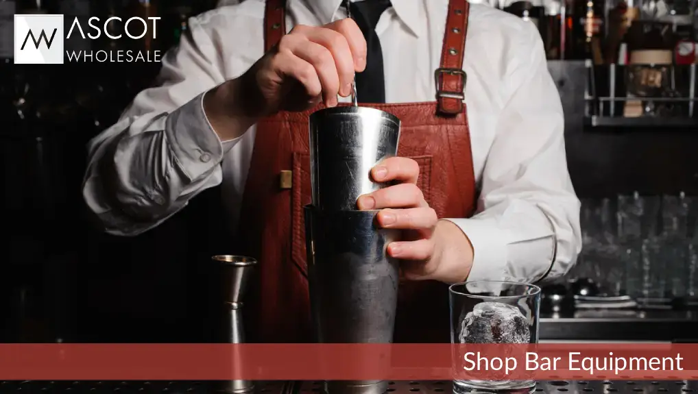 Image of a bartender with bar equipment including Boston cocktail shaker