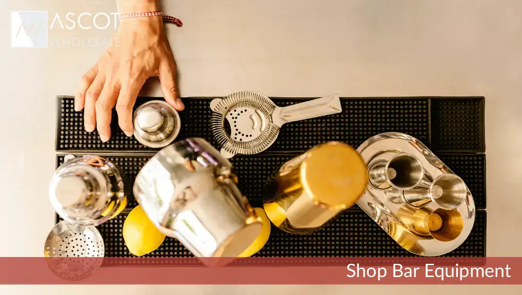 image of a collection of bar equipment overhead shot with a plane view of a selection of cocktail and drink service tools.