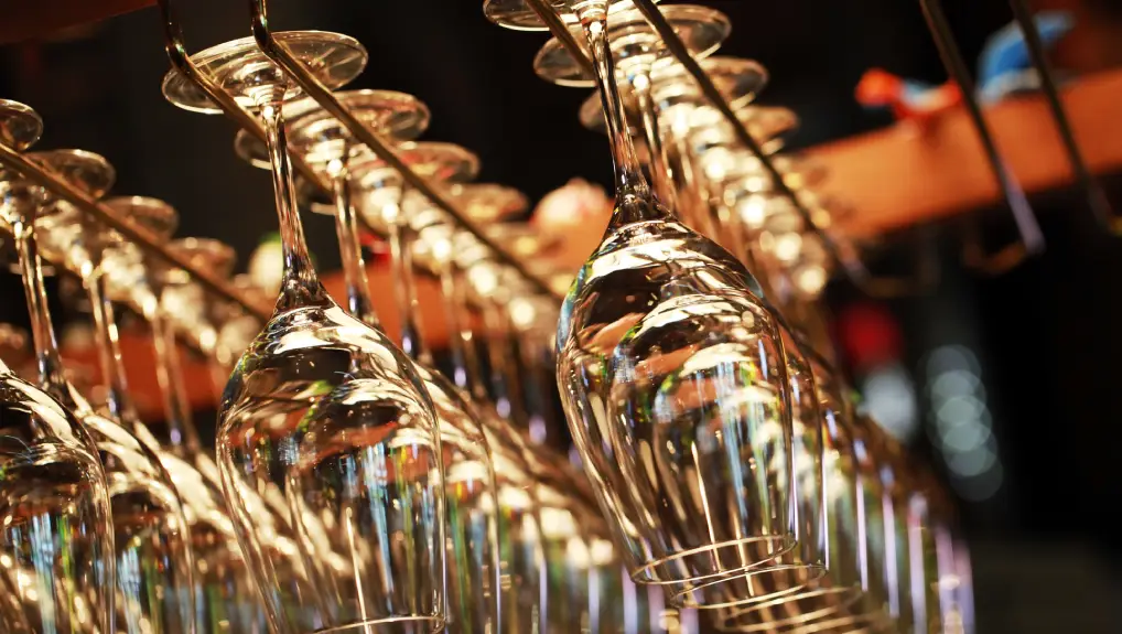 Image of Many empty glasses for a wine hanging in the bar