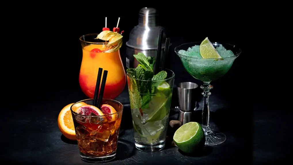 Image of Set of various colourful cocktails on black background 