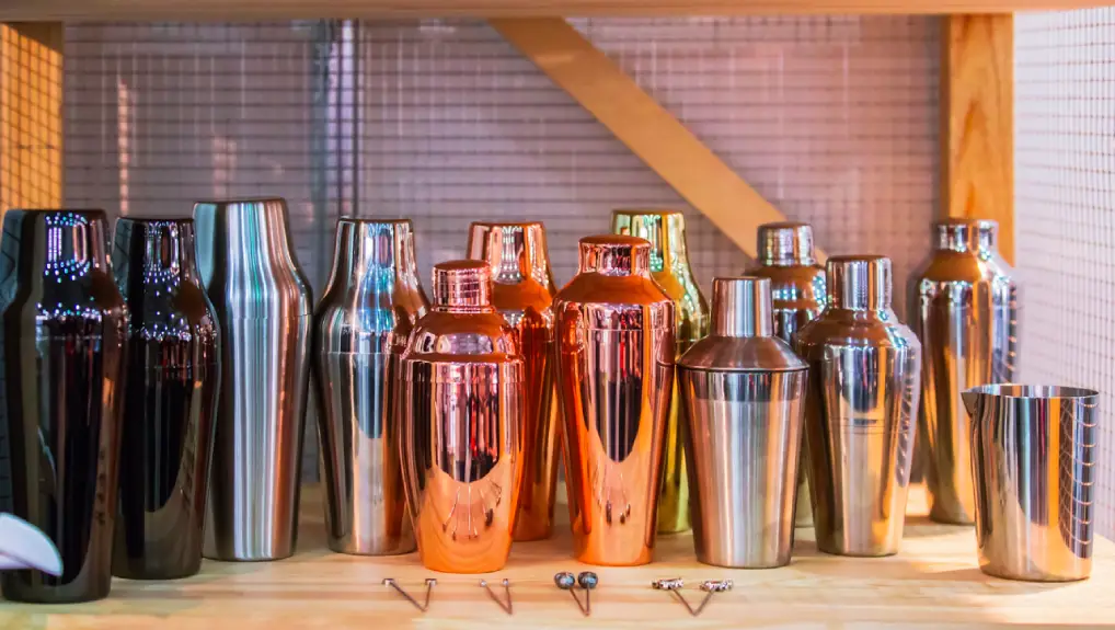 An image of 3 types of cocktail shakers on a bar