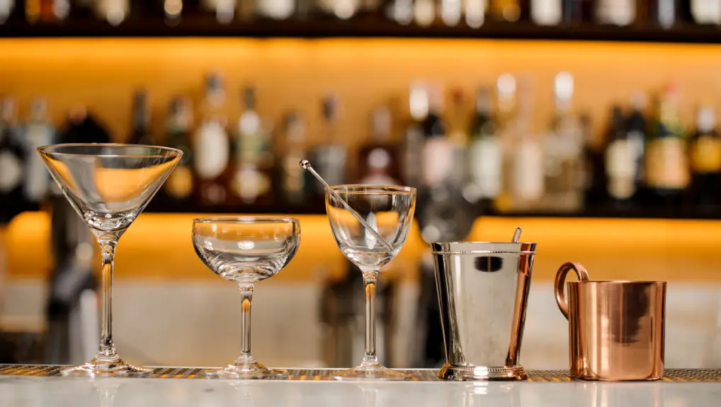 A selection of empty cocktail glasses with Cocktail-Making Tools