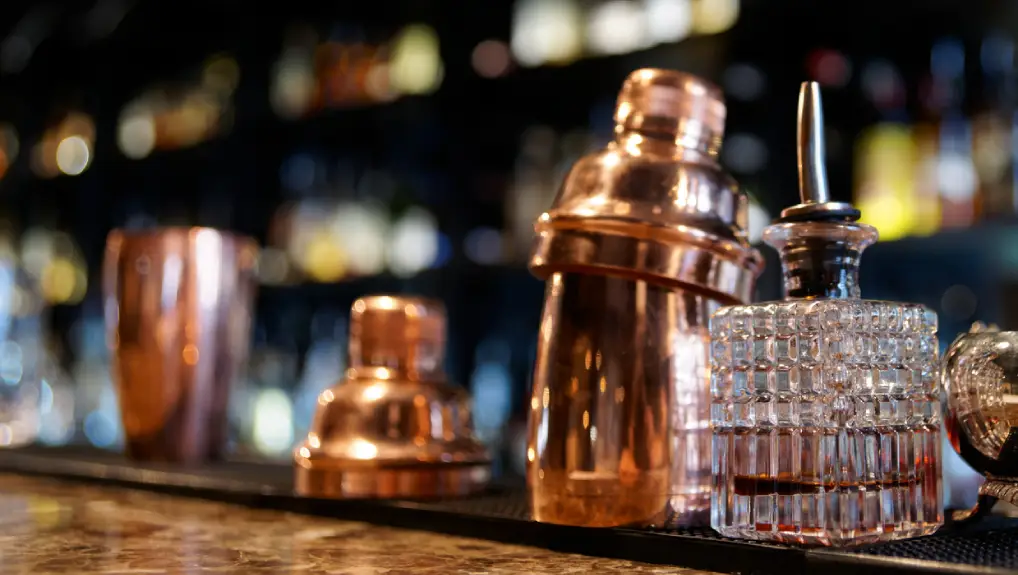 Close image of a commercial bar with a cocktail shaker in view