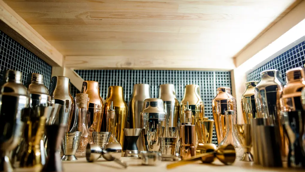 Image of essential bar tools and their function the image shows a view of a bar tool shelve with assorted bar tools.