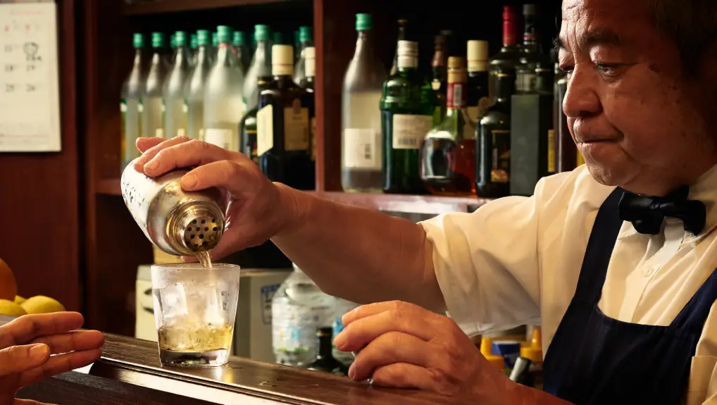 Older male bartender hospitality