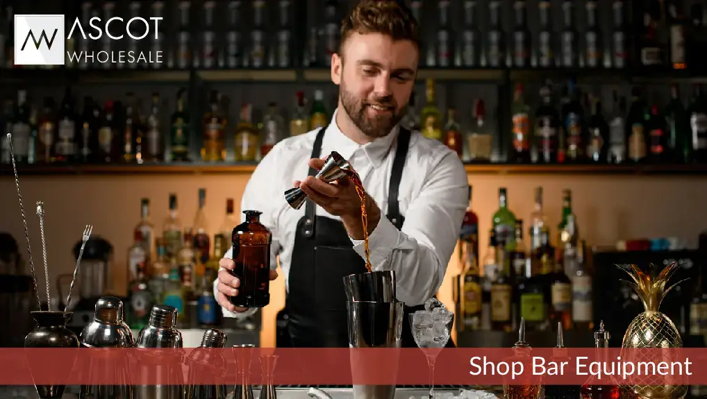 Image of a bartender making cocktails using bar equipment jigger and shaker.