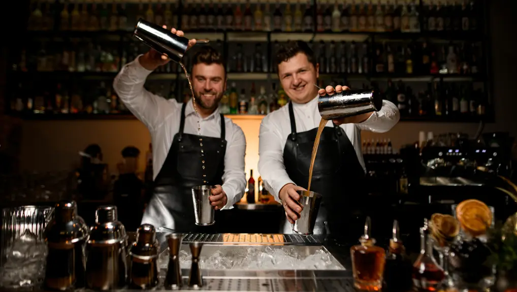 Image of two bartenders mixing drinks in an optimised commercial bar 