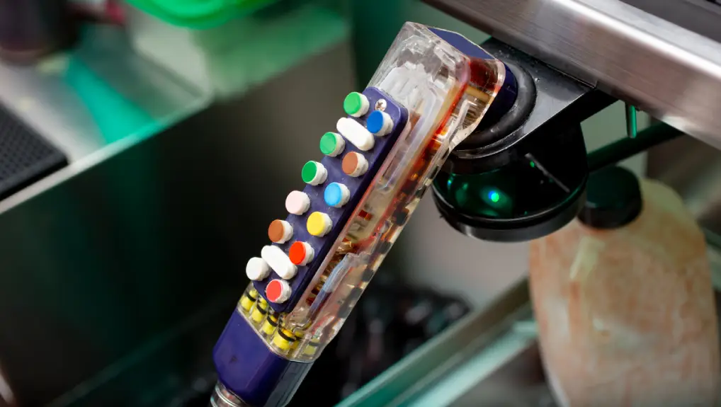 Image of a soda dispenser gun in a bar setting. Signs Your Bar Equipment Needs Maintenance