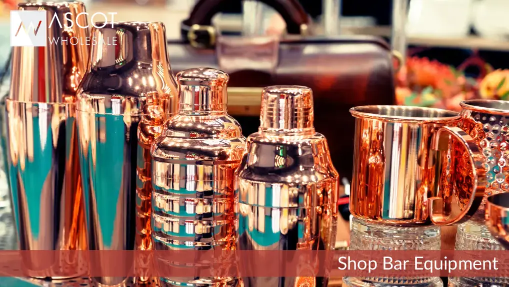 close image of bar equipment including cocktail shakers.