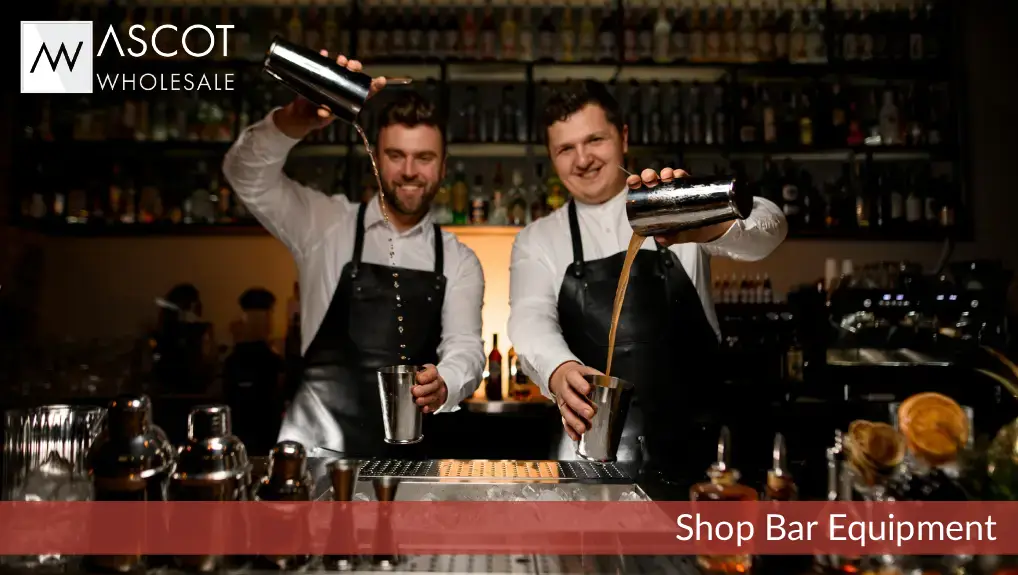 Image of two bartenders using bar equipment