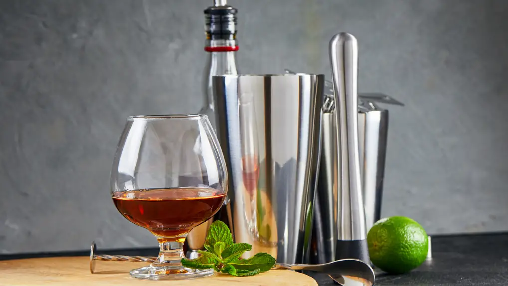 Image of bar tools on a wooden board