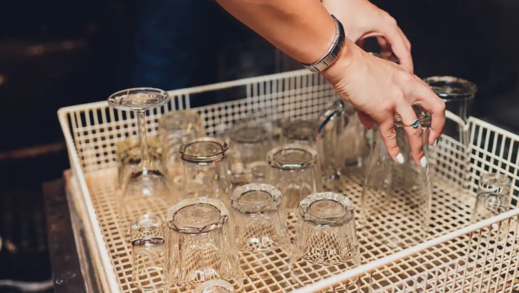 image of Discharging clean and shiny glasses from the dishwasher-
cleaning and care tips