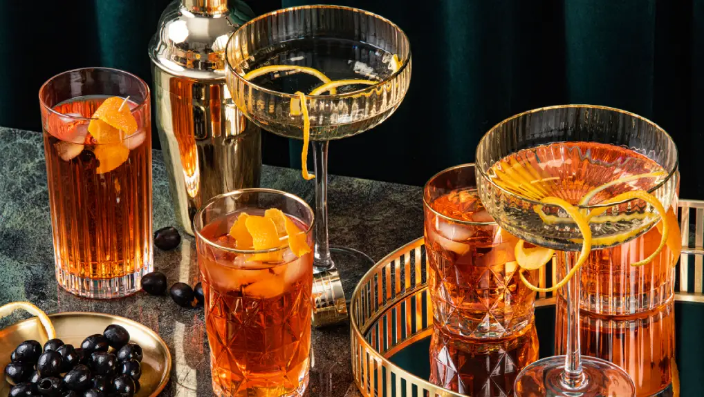 An image of classic cocktails- in art deco style. Elegant party with drink and some bit.