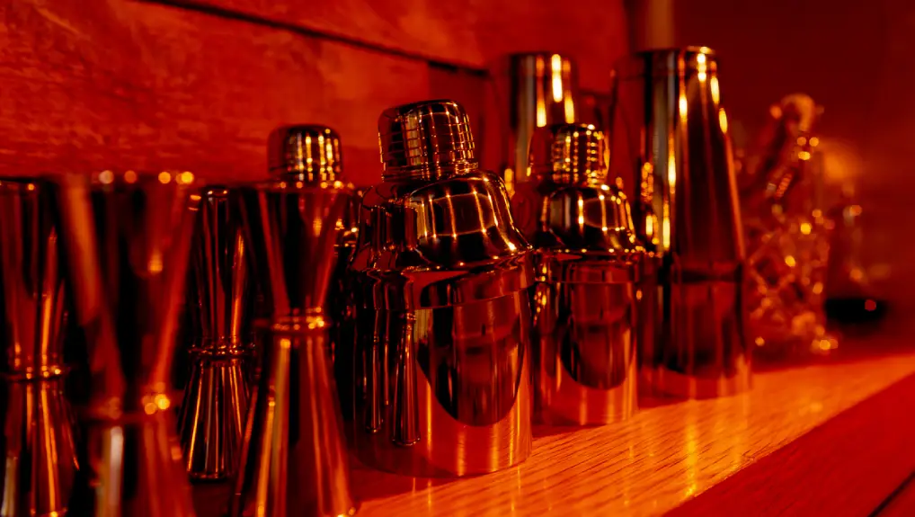 Image of a selection of the most popular cocktail shakers in an ambient low-light room