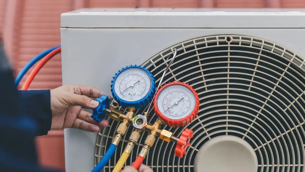 Image of Technician is checking air conditioner from commercial bar
