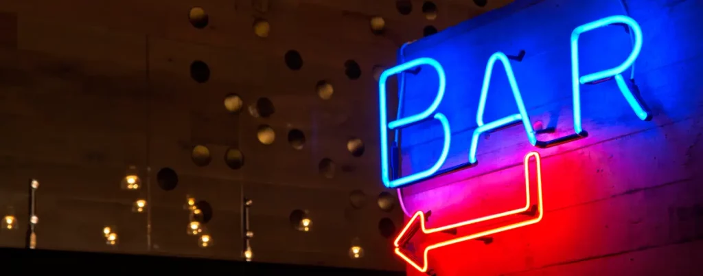 Neon gas bar sign or gas advertising on wall background in blue and red color