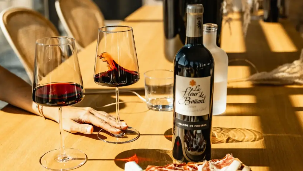 Stozle Lifestyle Image of 2 glasses filled with a classic red wine- glassware brand