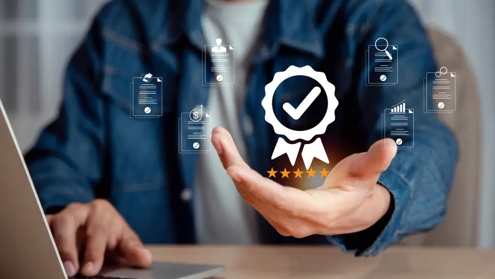 Businessman holding and showing the best quality assurance with five stars, ISO certification and standardization, Guarantee, Standards, Product and service warranty , Quality assurance concept .