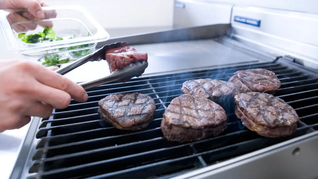Image of a Fryer cooking food - servicing maintaining catering equipment