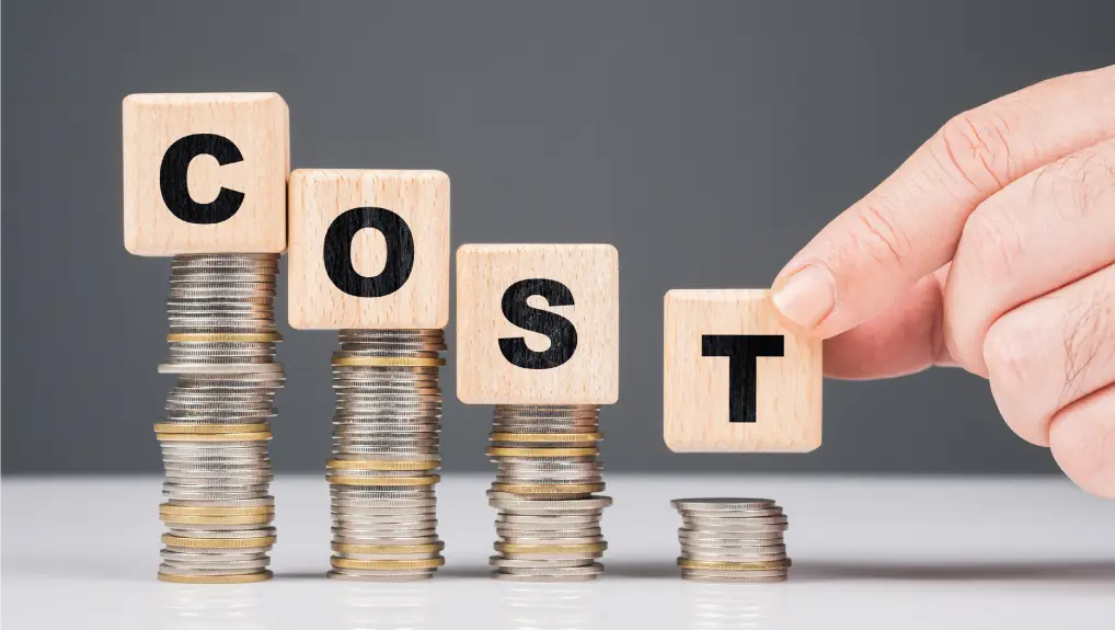 Hand put an alphabet wood cubes on the lower step of heap coins, reduce cost concept- bulk discounts trade accounts catering