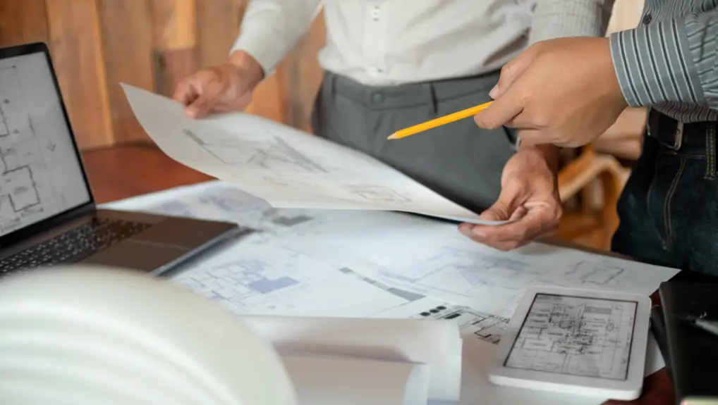 image of designer hands working with Blue prints and documents.
custom bar accessories branding