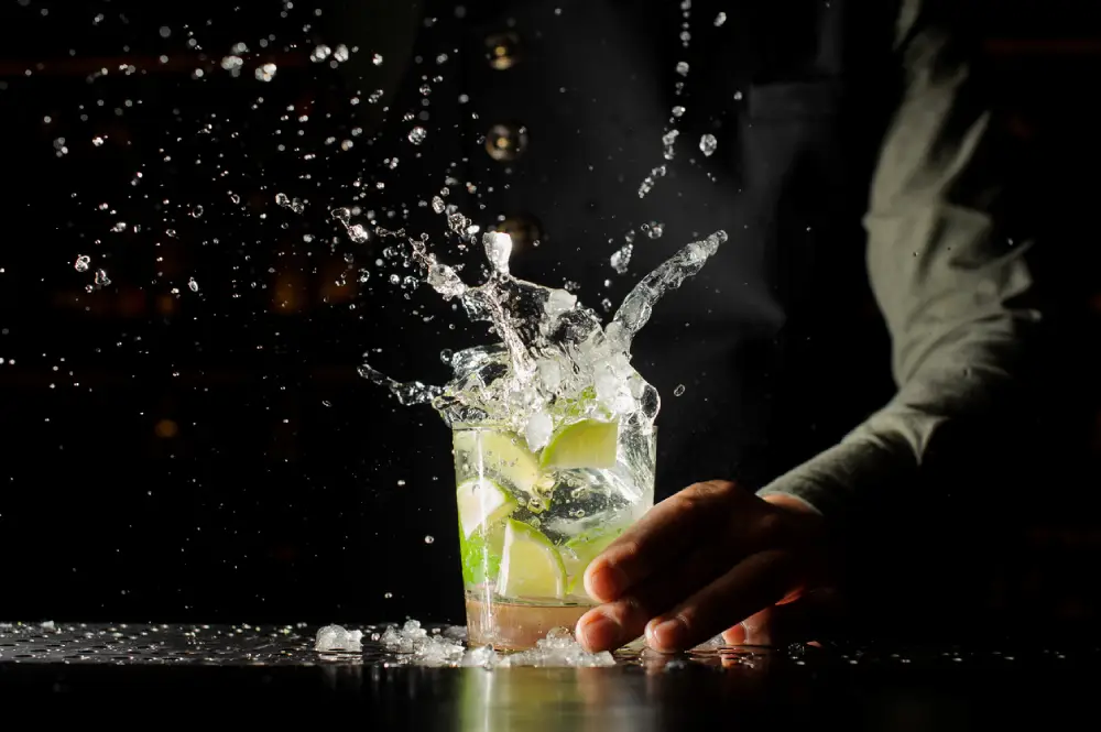 Image of a bartender slamming a rocks glass